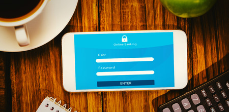 Online banking against smartphone on desk