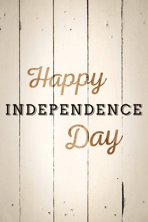 Independence day graphic against white woodの写真素材
