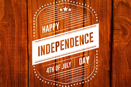 Independence day graphic against overhead of wooden planksの写真素材