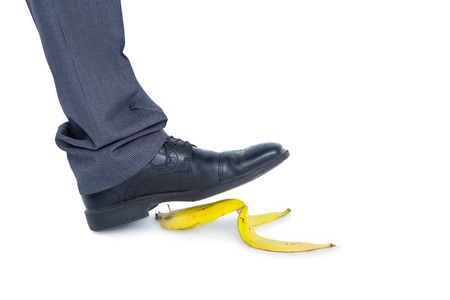 man walking on banana on white backgroundの写真素材