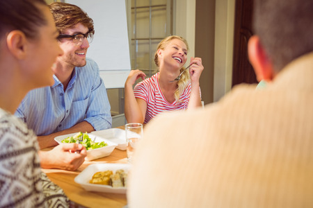Young business people having lunch togetherの写真素材