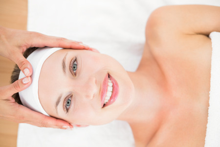 Beautiful blonde lying on massage table at the health spaの写真素材