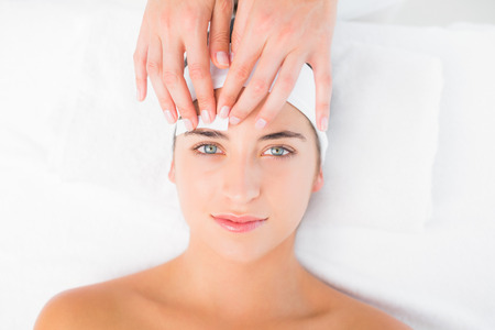 Close up of a hand waxing beautiful womans eyebrowの写真素材