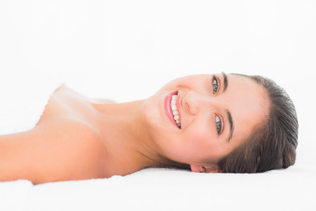 Portrait of a beautifulpretty young brunette with white backgroundの写真素材