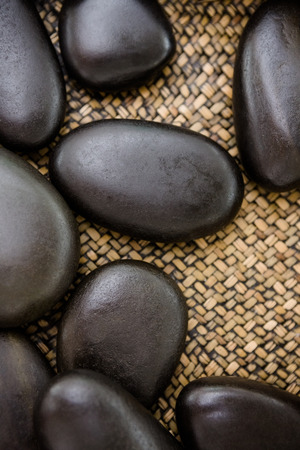 A piles of black stones at spa centerの写真素材