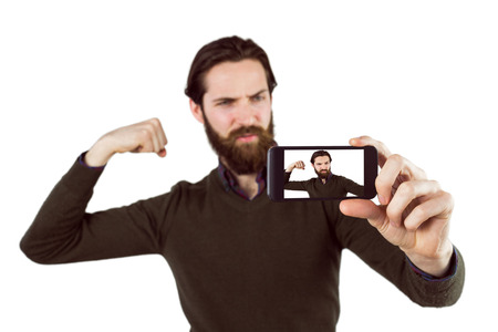 Handsome hipster taking a selfie on white backgroundの写真素材