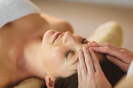 Young woman getting a massage in therapy roomの写真素材