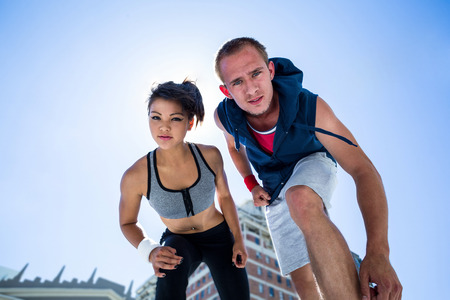 Portrait of a couple preparing to parkour on a sunny dayの写真素材