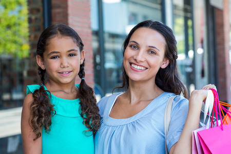 Portrait of a mother and her daughter at the mallの写真素材