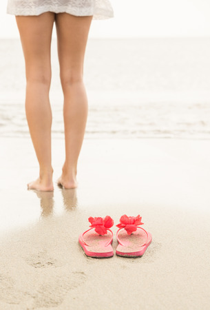 Woman paddling in the sea at the beachの写真素材