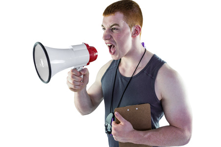Personal trainer yelling through the megaphone on a white backgroundの写真素材