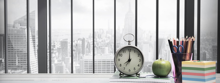 desk against room with large window looking on cityの写真素材