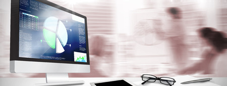 Computer screen against business interface with graphs and data