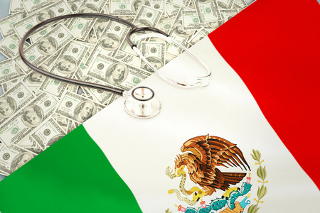 stethoscope against digitally generated mexican national flagの写真素材