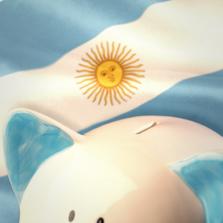 Piggy bank against argentinian flagの写真素材