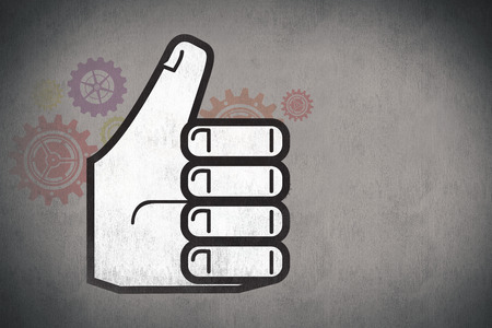 thumbs up against white and grey backgroundの写真素材