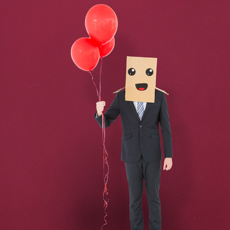 Anonymous businessman against red backgroundの写真素材