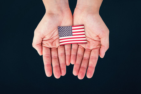 Hands showing against blue backgroundの写真素材