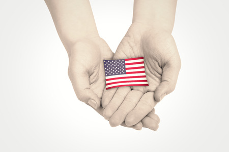 Hands presenting against usa national flagの写真素材