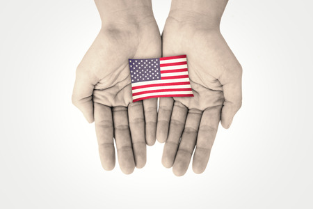 Hands showing against usa national flagの写真素材