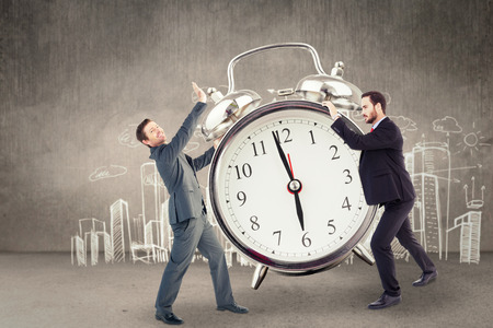 Businessman showing something with his hands against hand drawn city planの写真素材