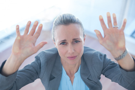 Businesswoman feeling trapped in an officeの写真素材