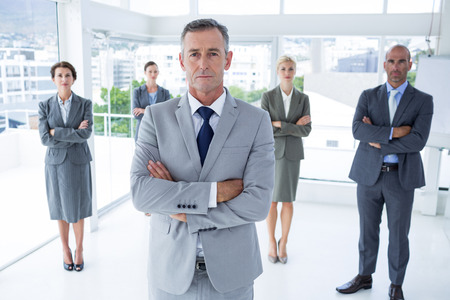 Businessman colleagues arm crossed in the office