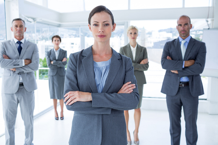 Businesswoman colleagues arm crossed in the officeの写真素材