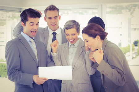 Business team celebrating a new contract in the officeの写真素材