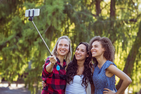 Handsome hipster taking a selfie in a parkの写真素材