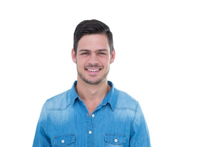 Handsome hipster smiling at camera on white backgroundの写真素材
