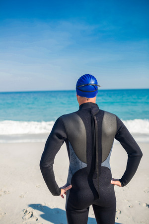 Swimmer getting ready at the beach on a sunny dayの写真素材