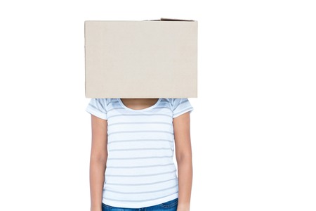 Woman with box over head on white backgroundの写真素材