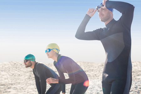 Swimmers getting ready at the beach on a sunny day
