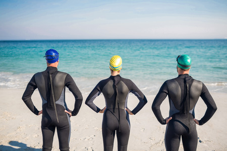 Swimmers getting ready at the beach on a sunny dayの写真素材
