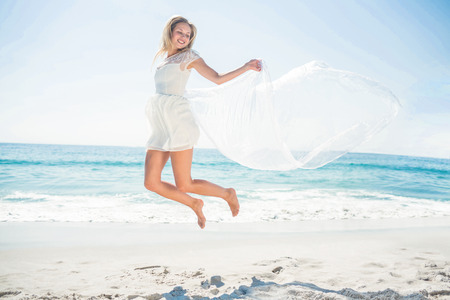 happy woman smiling at the beachの写真素材