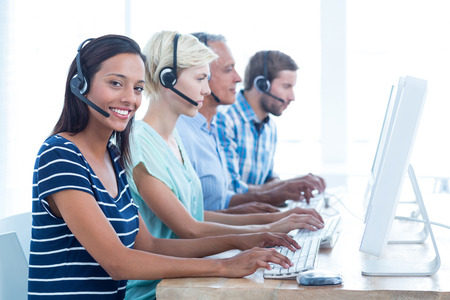 Portrait of young casual call centre workers in the officeの写真素材