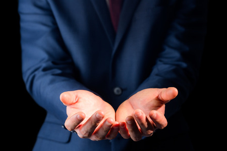 Close up view of businessman hands on black backgroundの写真素材