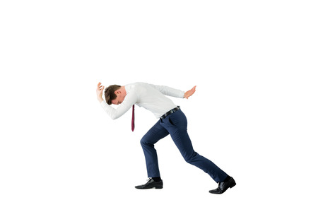 Businessman starting to run on white backgroundの写真素材