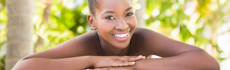 Close up of a beautiful young woman on massage table at health farmの写真素材
