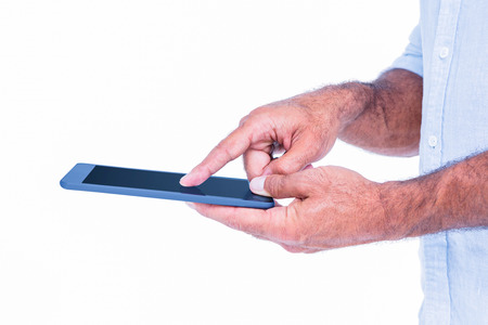A man using tablet computer on white backgroundの写真素材
