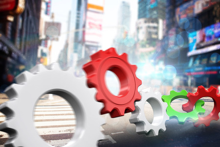 White and red cogs and wheels against blurry new york streetの写真素材