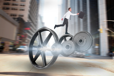 Businessman walking with his briefcase against new york streetの写真素材