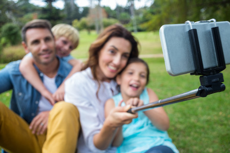 Happy family in the park together on a sunny day