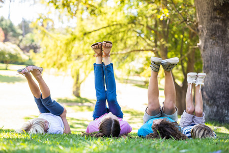 Child having fun in a park on a sunny dayの写真素材