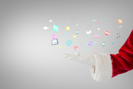 Santa claus presenting with hand against grey vignetteの写真素材