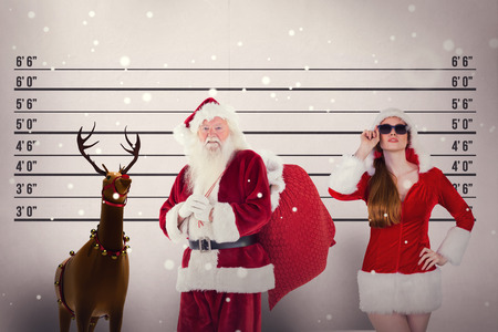 Santa carries his red bag against mug shot backgroundの写真素材
