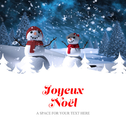 Joyeux noel against snowman familyの写真素材