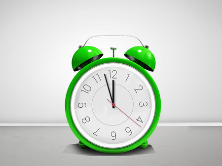 Alarm clock counting down to twelve against grey room