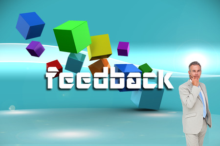 Thinking businessman against futuristic bright blue backgroundの写真素材